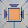 Micrograph of yellow square with lines attached to each corner.