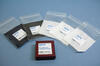 Five fabric swatches in clear plastic bags labeled 10279 are arrayed around a box labeled 99% Reflective Calibration Target. 