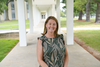 Erica Romsos poses outdoors on the NIST campus. 