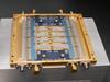An array of sensors appear as a set of rectangles within a gold-colored metal frame.