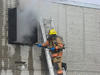 fire fighter ventilating a building